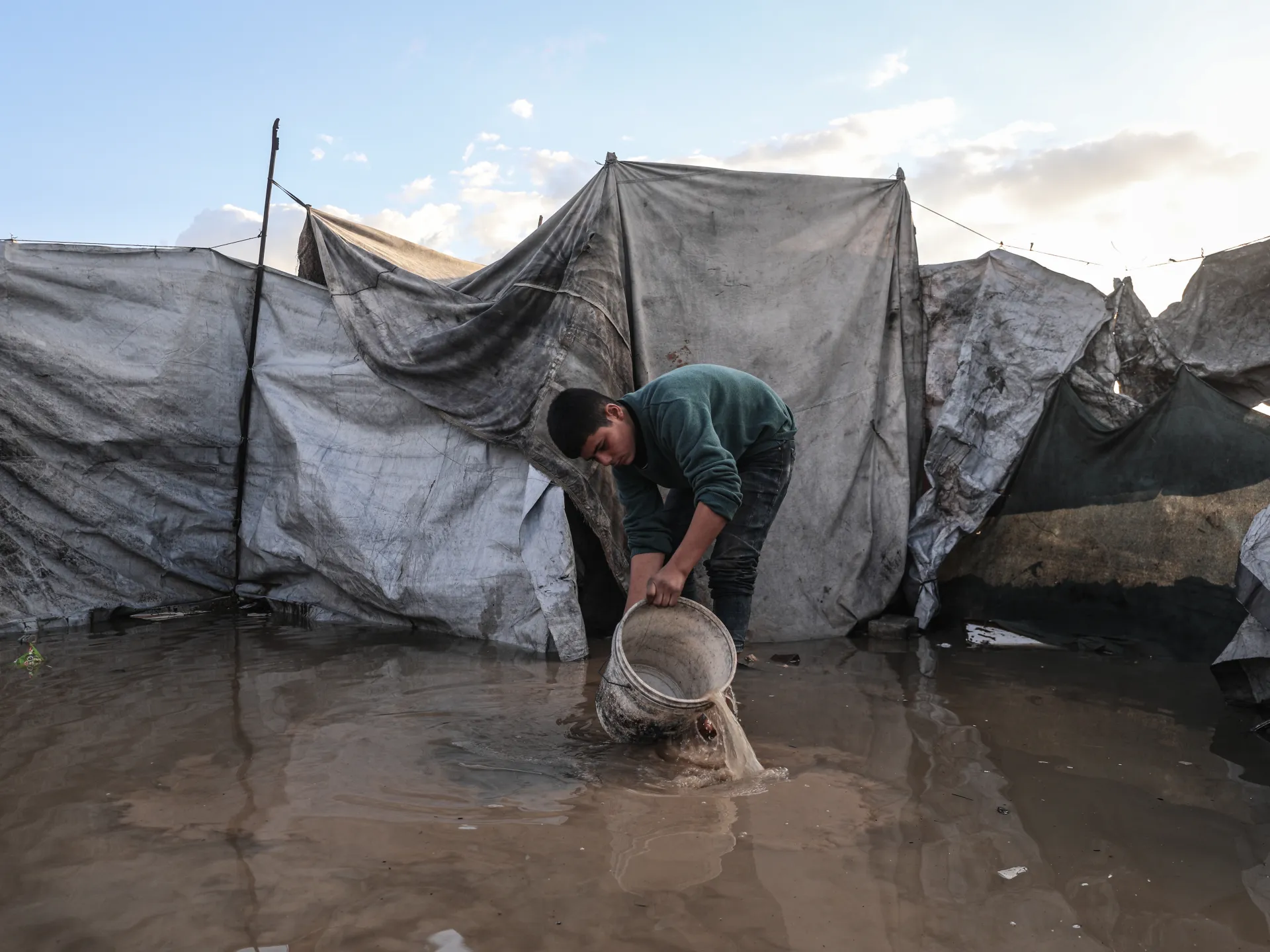 Palestinians suffer flooded tents and debris as cold and rain lash Gaza | Israel-Palestine conflict News