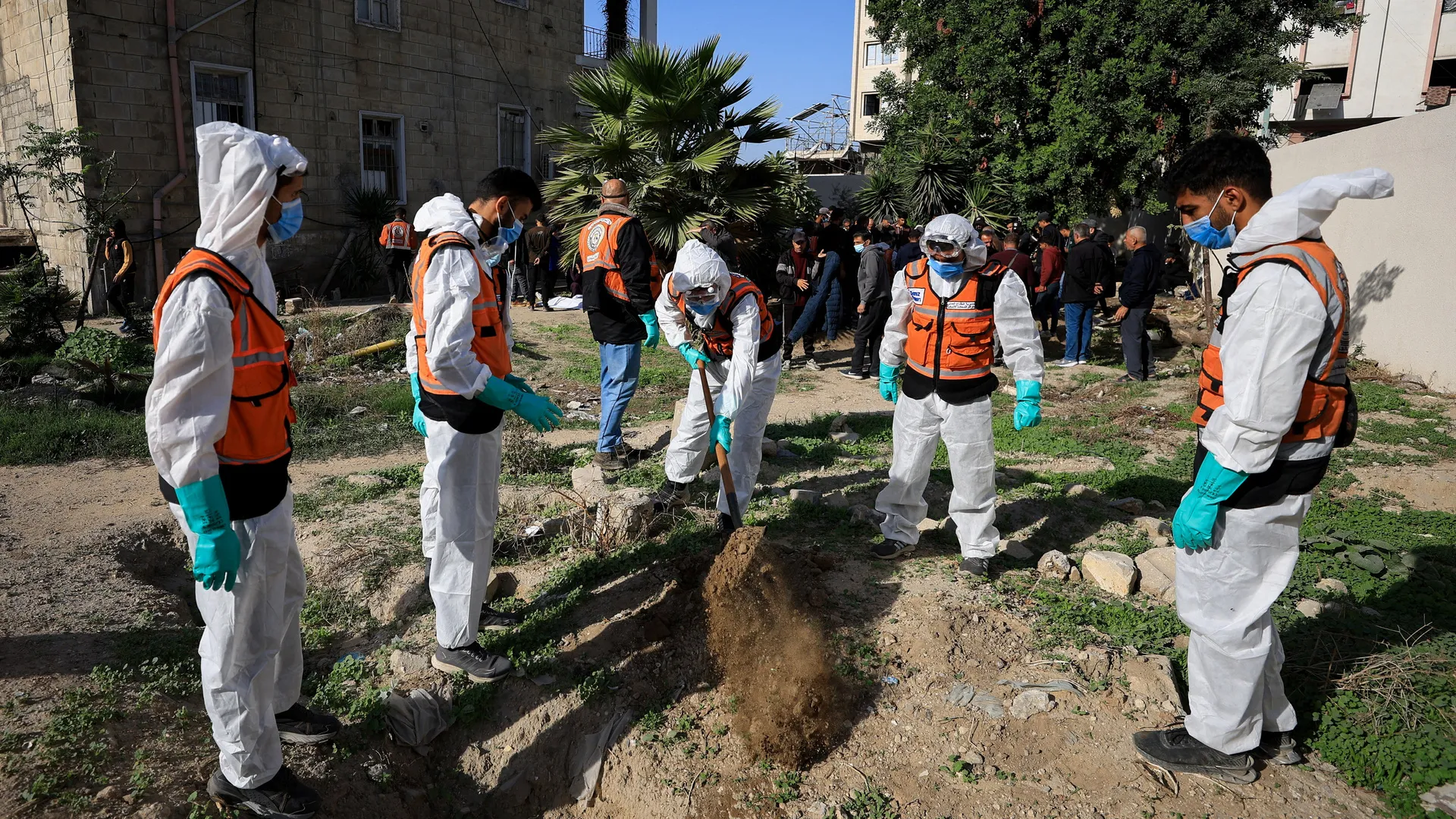 Dozens of bodies hastily buried at al-Shifa Hospital moved to graveyards | Gaza